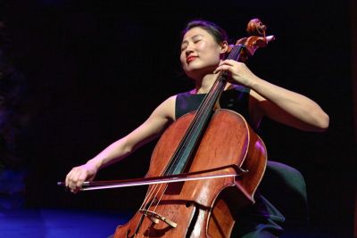 Woman playing on cello.