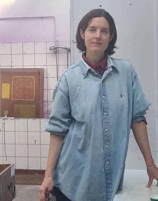 A woman in an artistic studio.