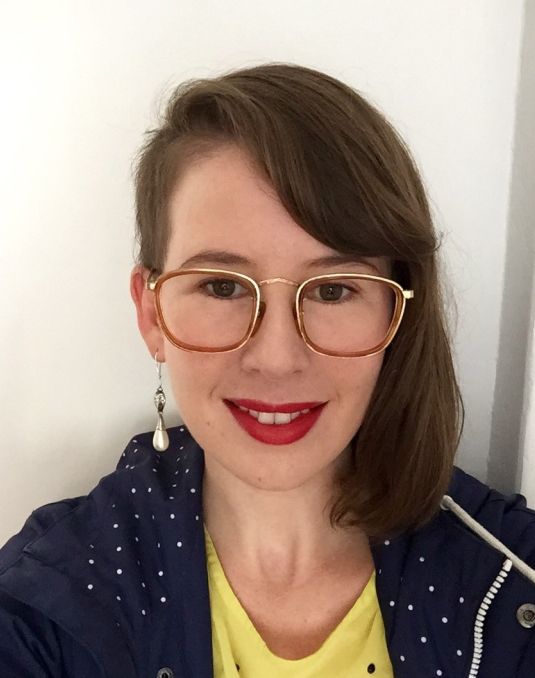 Portrait image of person with shoulder length brunette hair. 