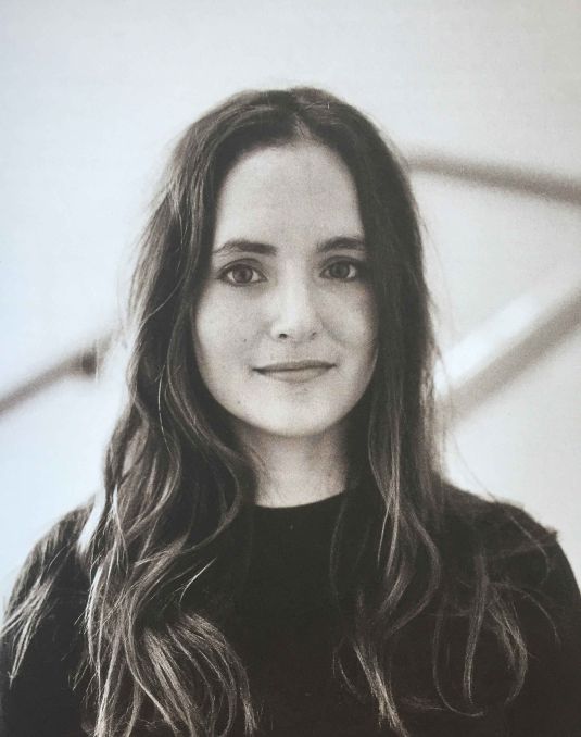 Black and white portrait of Pilar Mata Dupont. A woman with long brown hair. 