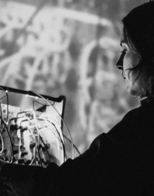 Person standing before an electronic dashboard. 