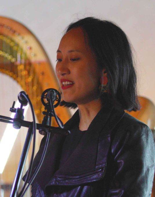 Woman speaking at podium,
