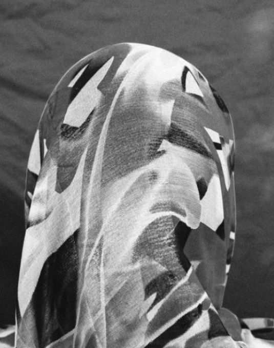 Artwork with hooded face.